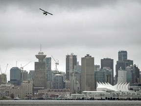 A seaplane takes off ahead of an imminent storm in downtown Vancouver, B.C., on Aug. 6, 2020.