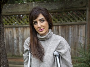 Azi Ramezani, a Vancouver woman who was attacked by a coyote in Stanley Park, stands in her parents backyard in Victoria on March 4.