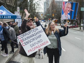 Dozens of people attend a rally outside the B.C. Supreme Court in Vancouver on Wednesday in support of a petition filed by the Justice Centre for Constitutional Freedoms asking the court to dismiss tickets of up to $2,300 each for violations of public health orders related to the closure of churches. The rally was as concentrated on anti-vaccine and anti-mask messages as the freedom to pray in churches.