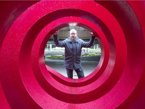 Sound artist and musician Brady Cranfield at Robson Plaza. His Weekend Chime plays on four speakers that are all painted as close as possible to the red of the leather pants seen from behind on the front of Loverboy’s Get Lucky, the 1981 album with the lead single Working for the Weekend.