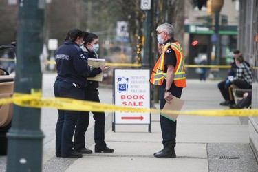 North Vancouver RCMP and BC Paramedics at the scene of a multiple stabbing at the Lynn Valley branch of the North Vancouver Public Library in North Vancouver, Saturday, March 27, 2021.