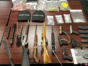 Handout photos from Surrey RCMP of seized firearms, drugs and body armour from a condominium in Whalley. A new law would toughen measures against illegal guns.
