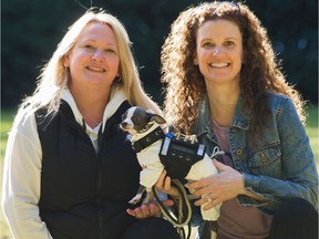 Alison Columbus and Janice Voth of PredatorBWear with Alfie in North Vancouver, March 15, 2021. Their North Vancouver company makes protective vests for small dogs.