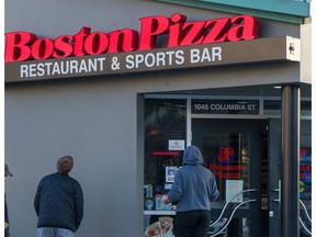 VANCOUVER, BC - March 16, 2021  - Boston Pizza in New Westminster, BC, March 16, 2021. The Boston Pizza on Columbia Street in New Westminster told its female staff last week they had to wear skirts to work. The company now says the dress-code policy was "miscommunicated," although the company's own manual on dress clearly says "front-of-house" employees - servers and hosts - must wear a skirt.

Photo by Arlen Redekop / Vancouver Sun / The Province (PNG) (story by reporter) [PNG Merlin Archive]