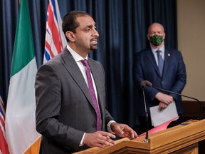 Jobs, Economic Recovery and Innovation Minister Ravi Kahlon at the podium, with Premier John Horgan watching, as the province announces on Wednesday it is adding $30 million to the Launch Online grant for small and medium-sized businesses to market products and services online.