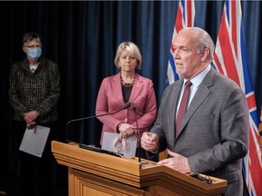 Premier John Horgan and Dr. Bonnie Henry at a news conference in Victoria on March 18, 2021.