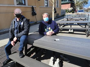 Ken Beattie (r), the executive director of the BC Craft Brewers Guild with Nigel Pike, who owns Main Street Brewing Co., in Vancouver, BC. on March 31, 2021.