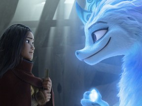Raya (voiced by Kelly Marie Tran) and the Last Dragon, Sisu (voiced by Awkwafina) share a moment in Raya and the Last Dragon.
