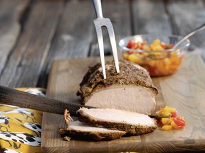 Chef Michael Olson coats his boneless pork loin with a pepper- and thyme-spiked layer of Dijon mustard and serves it with a divine roasted apple sauce.