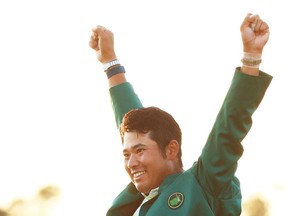 Hideki Matsuyama of Japan celebrates during the Green Jacket Ceremony after winning the Masters at Augusta National Golf Club on April 11 in Georgia.