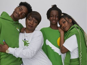 Moyosola King is pictured second from left in a campaign for the Aritzia Community x Cause We Care collection with her children Jesse, Salem and Eden.