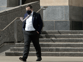 Alberta Premier Jason Kenney leaves the Alberta Legislature on April 8, 2021. Alberta's breakdown of COVID cases has 5,408 active cases in the Calgary zone, 2,640 in the Edmonton zone, 934 in central Alberta, 1,522 in the north, and 865 in the south.