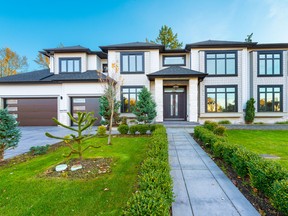 This Langley home is impressive in size, elegant in design and outfitted with fun details like secret doors and enough parking for all your ATV and boating needs.