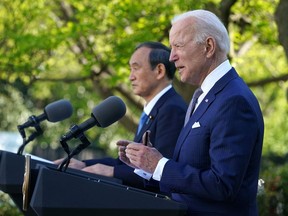 U.S. President Joe Biden (right) with Japanese Prime Minister Yoshihide Suga in the Rose Garden of the White House in Washington, D.C., on April 16, 2021.