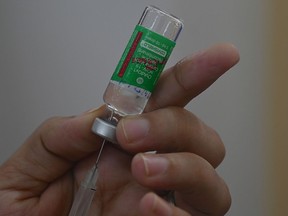 A syringe is filled with the AstraZeneca Covishield vaccine.