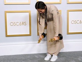 Director/Producer Chloe Zhao, winner of the award for best picture for "Nomadland," poses in the press room at the Oscars, in Los Angeles, April 25, 2021.