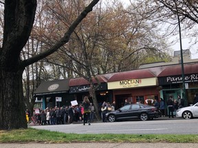 Corduroy owner Rebecca Matthews organized a rally outside her restaurant to protest recent public health orders.