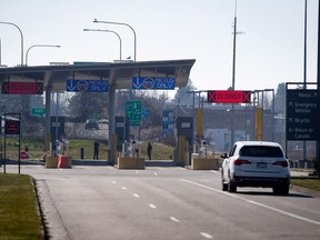 A B.C. motorist approaches the U.S. port of entry into Blaine, Wash., at a very quiet Douglas-Peace Arch border crossing amid the coronavirus pandemic on Wednesday, March 18, 2020.