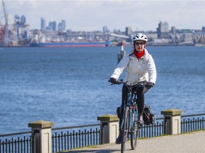 A cyclist enjoys the sunny weather in Vancouver in March 2021.