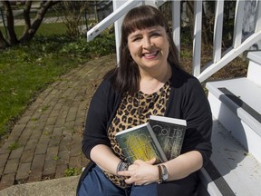 Author G.S. Prendergast with her books: Zero Repeat Forever and Cold Falling White.