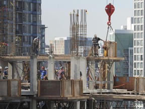 Workers on the top floor of a highrise construction project in Downtown Vancouver in 2013.
