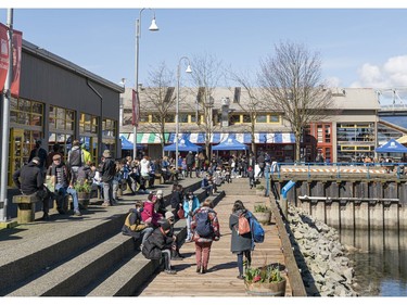 VANCOUVER,B.C.: MARCH 22, 2021 -- Visitors to Granville Island gather on the steps outside the market in Vancouver, BC, March, 22, 2021. (Richard Lam/PNG) (For ) 00064163A [PNG Merlin Archive]