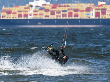 VANCOUVER,BC:APRIL 4, 2021 -- A kitesurfer goes for a ride while kitesurfing at Kits Beach in Vancouver, BC, April, 4, 2021. (Richard Lam/PNG) (For ) 00064274A [PNG Merlin Archive]