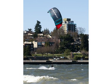 VANCOUVER,BC:APRIL 4, 2021 -- A kitesurfer takes advantage of the windy conditions at Kits Beach in Vancouver, BC, April, 4, 2021. (Richard Lam/PNG) (For ) 00064274A [PNG Merlin Archive]
