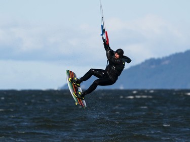 VANCOUVER,BC:APRIL 4, 2021 -- A kitesurfer goes airborne while kitesurfing at Kits Beach in Vancouver, BC, April, 4, 2021. (Richard Lam/PNG) (For ) 00064274A [PNG Merlin Archive]