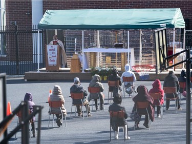 VANCOUVER,BC:APRIL 4, 2021 -- Parishioners of St. Francis Xavier Church attend Easter Mass in the school playground in Vancouver, BC, April, 4, 2021. (Richard Lam/PNG) (For ) 00064274A [PNG Merlin Archive]