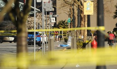 Yellow tape outside Cardero's Restaurant on the Coal Harbour Quay on April 18, 2021, one day after police responded to a shooting that left one person dead and another hospitalized.