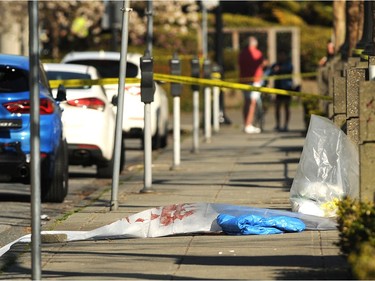 Yellow tape outside Cardero's Restaurant on the Coal Harbour Quay on April 18, 2021, one day after police responded to a shooting that left one person dead and another hospitalized.