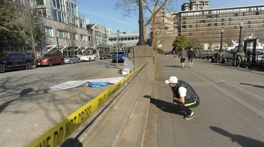 Yellow tape outside Cardero's Restaurant on the Coal Harbour Quay on April 18, 2021, one day after police responded to a shooting that left one person dead and another hospitalized.