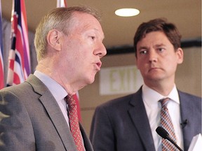 Money laundering report author Peter German with B.C. Attorney-General David Eby.
