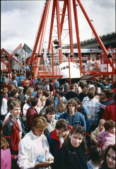 Expo 86 Rides.  Crowds waiting for rides on Looping  Starship ride at Expo 86. Province  Filed May 19, 1986. Colin Price Province. [PNG Merlin Archive] Sunday feature Expo 86 30th anniversary