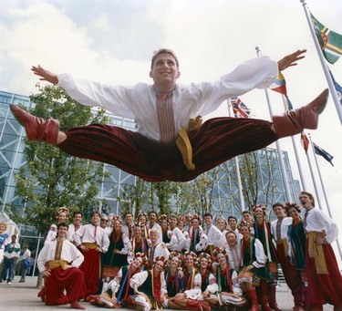 Dance troupe leaps for Expo. Glenn Solar, of the Russian Ukrainian Dance Troupe from Winnipeg, Manitoba, still has enough energy to do s few leaps for our photographer after his performance yesterday. You can catch the group doing it's stuff today at 1 pm in the Plaza of Nations. Photo by Colin Price, Province. Ran July 23, 1986 P-1. 86-2433. Photo Digitization Project 2016. [PNG Merlin Archive]
Sunday feature Expo 86 30th anniversary