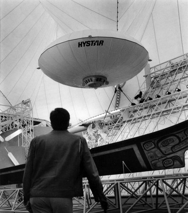 Expo 86- -Exhibits. Visitor to Canada Pavilion at Expo 86 watch Hystar saucer in action. Taken April 27, 1986. Ran June 7, 1987 pg. 29 Province. Colin Price Province. Sunday feature Expo 86 30th anniversary [PNG Merlin Archive]