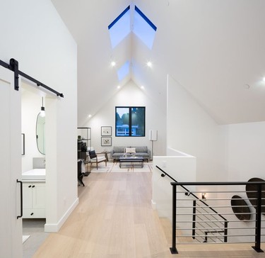 A vaulted, open-plan area on the second floor was designed with potential to wall off a second bedroom in case of resale.