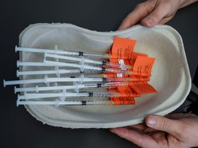 Syringes with the AstraZeneca vaccine are pictured in Laakso hospital in Helsinki, Finland, March 11, 2021.