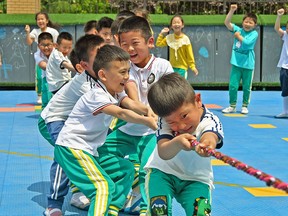 Children play at a kindergarten in Yantai in China's eastern Shandong province on May 31, 2021.
