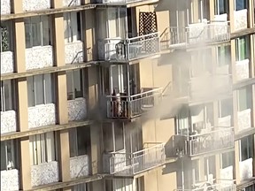 Firefighters fought through thick black smoke to pull a man in his 70s from the burning suite in the 23-storey Pacific Sands Apartments on Gilford Street near Pendrell Street. He later died in hospital