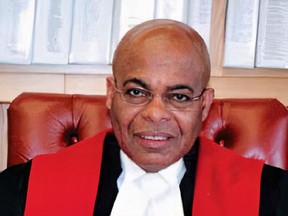Selwyn Romilly, the first Black judge named to the B.C. Supreme Court, was handcuffed by police who were searching for another suspect.