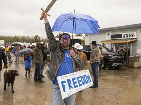 Supporters gather during a rally against measures taken by government and health authorities to curb the spread of COVID-19 at the Whistle Stop Cafe in Mirror, Alberta, on Saturday, May 8, 2021. The Whistle Stop was shut down by AHS for not following public health rules.