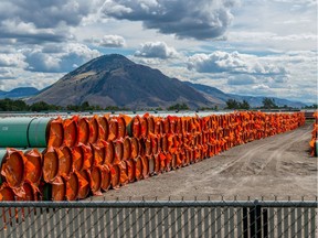 Steel pipe for the construction of the Trans Mountain pipeline expansion sits at a stockpile site in Kamloops in this file photo from June 18, 2019.