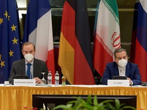 European External Action Service (EEAS) Deputy Secretary General Enrique Mora and Iranian Deputy at Ministry of Foreign Affairs Abbas Araghchi wait for the start of their meeting in Vienna, Austria, on May 1, 2021.