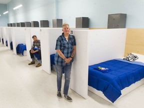 Duncan Higgon, senior manager of housing at the Portland Hotel Community Services Society, left, and Tanya Fader, director of housing for the PHS, at the former Army & Navy department store in Vancouver's Downtown Eastside on May 13.