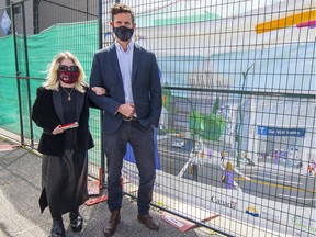 Laura Mackenrot, a member of Vancouver’s persons with disabilities advisory committee, with Green Coun. Michael Wiebe at the construction site for a Broadway Subway station.