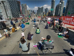 tinction Rebellion, a global environmental movement, occupies the Granville Bridge in Vancouver, BC, May 2, 2021.