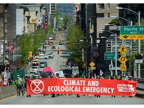 Extinction Rebellion, a global environmental movement, occupies the Granville Bridge in Vancouver, BC, May 2, 2021.