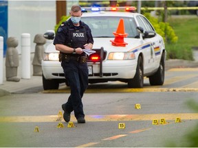 File photo: Police investigate a shooting in Langley May 3, 2021. On Saturday, the B.C. government announced it was giving more than $8 million to programs to curb gang violence.